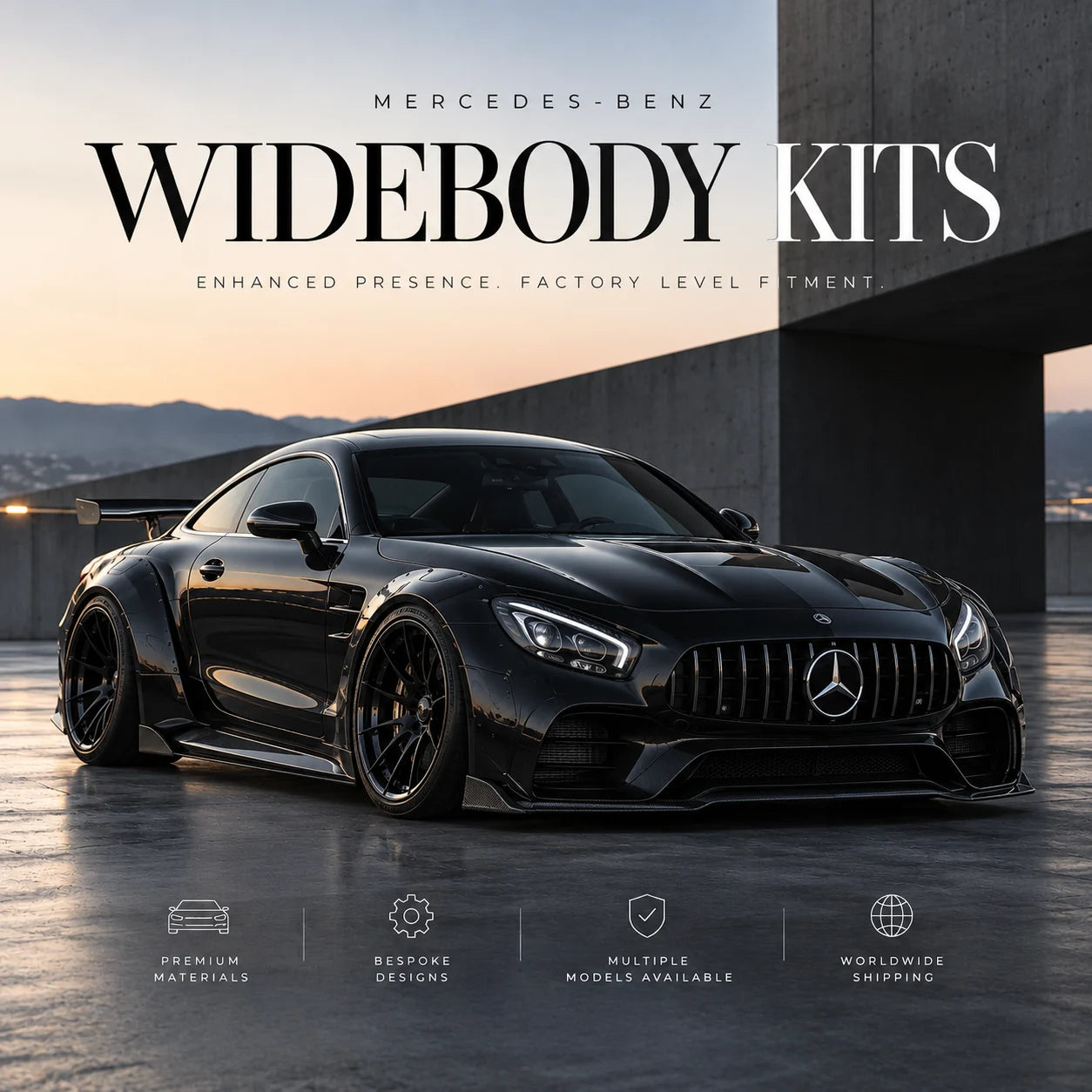 A black Mercedes-Benz widebody sports car shown in a dramatic urban setting at dusk, with large overlaid text reading 'MERCEDES-BENZ WIDEBODY KITS' and smaller marketing copy. The car is photographed at an angle, emphasizing its wide body and aggressive front grille.