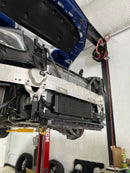 ModalWorks bar-and-plate transmission oil cooler mounted on a Mercedes-AMG GLC63